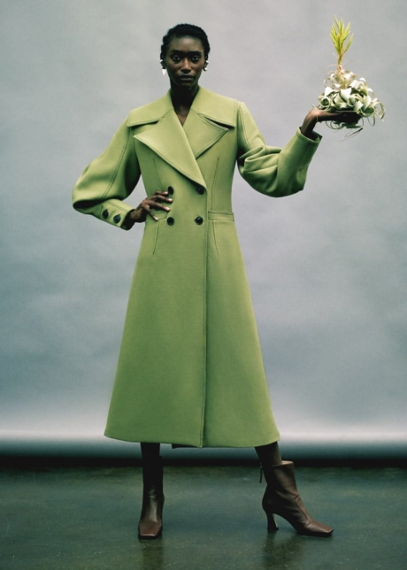 Fashion editorial black model green coat