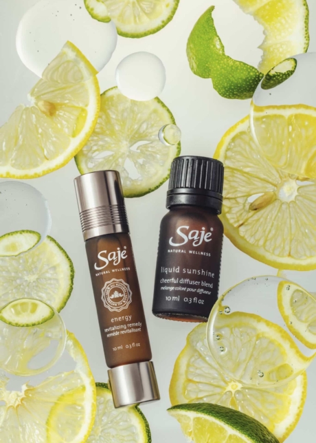 Product styling for saje bottles styled with slices of lime and lemon