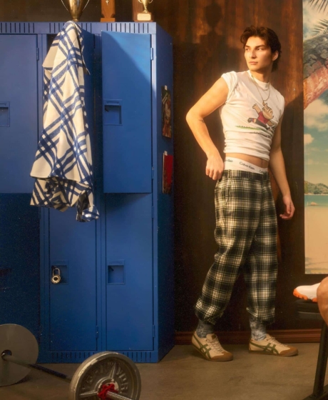 Set design for vintage gym blue lockers and silver dumbells