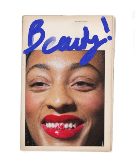 Beauty magazine over red lips and stained red front teeth
