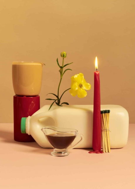 Product styling for Milkys Café Toronto expresso little cup candle milk bottle late and a yellow flower