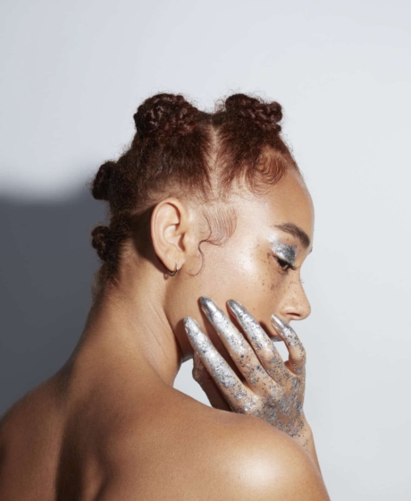 Beauty portrait shot. Silver hands and eye shadows. Updos hair styles.