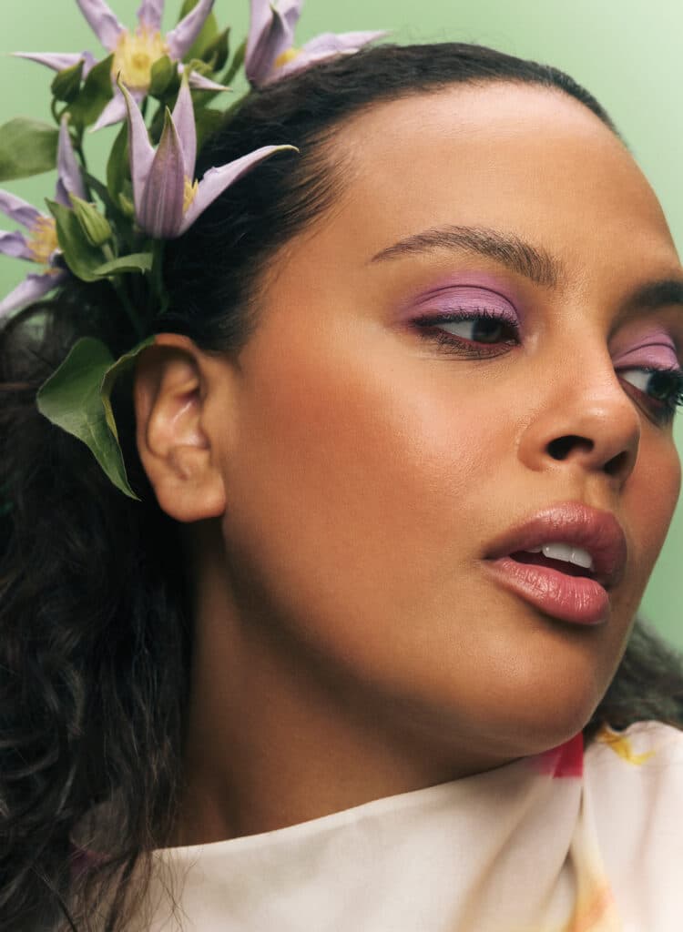 Close up portrait shot purple flower hairstyle TheBeautyAwards