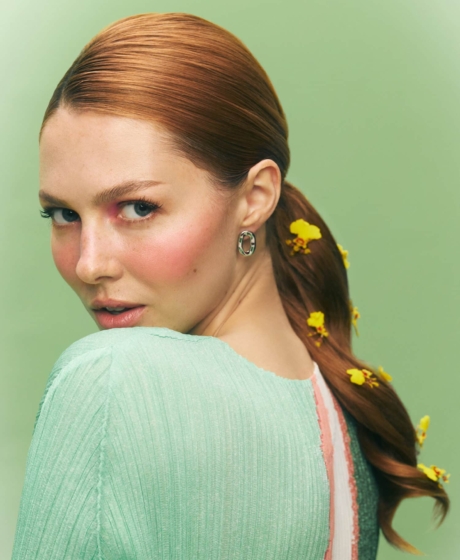 Portrait shot slick hair ponytail with yellow flowers TheBeautyAwards